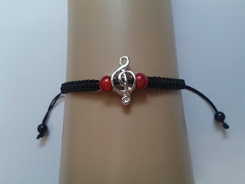 Musical charm bracelet with red beads