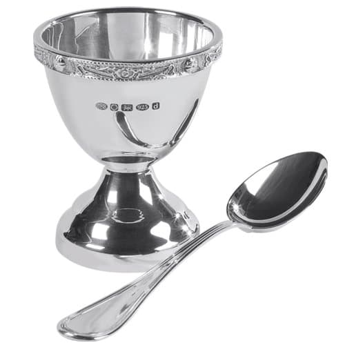 Sterling Silver egg cup and spoon with pretty celtic design. Perfect gift for a new baby or christening. Complete with presentation case.