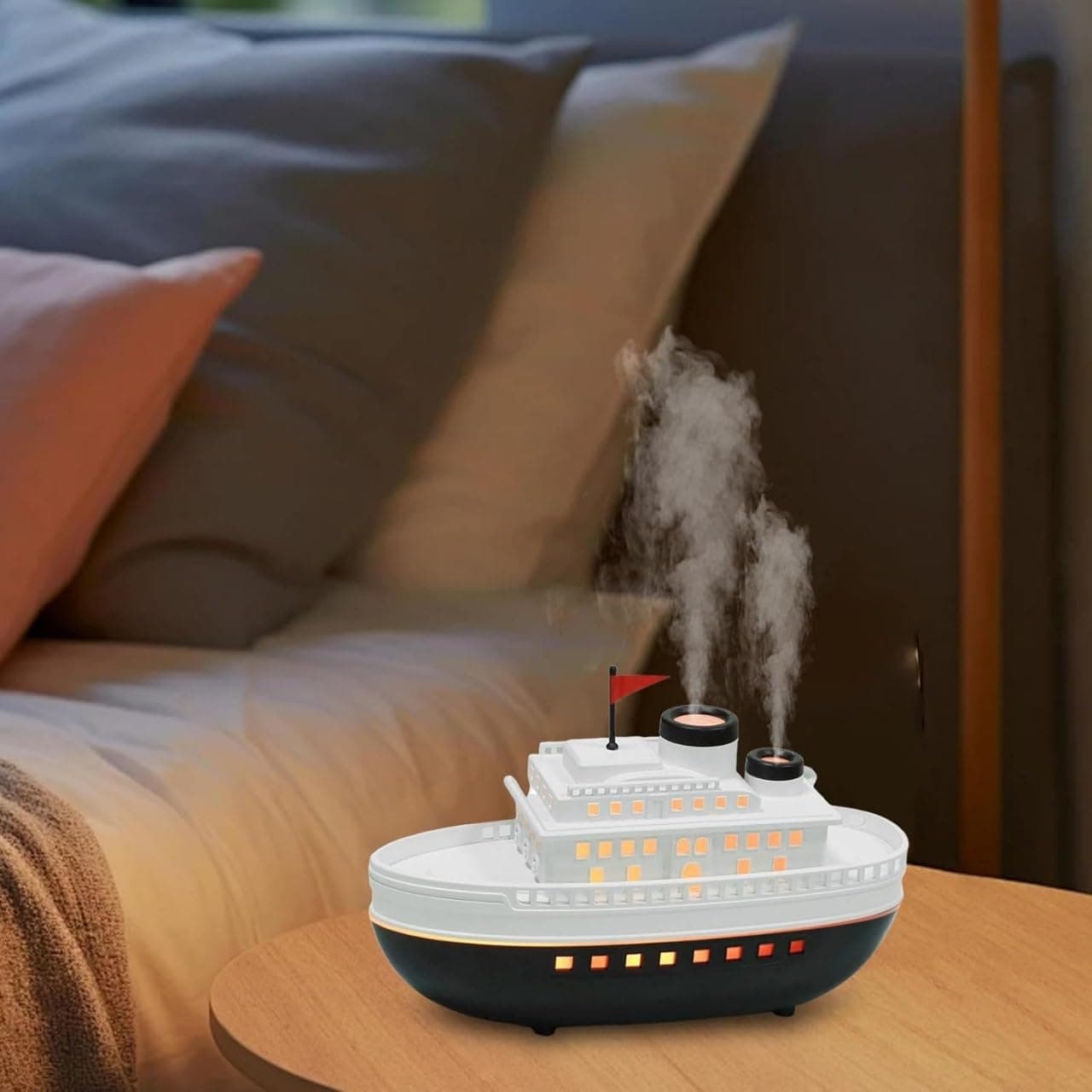 - Creative Ship Humidifier with LED lights and dual mist outlets. Perfect for bedrooms, offices, and gifts. Adds moisture, improves air quality, and enhances décor with unique design