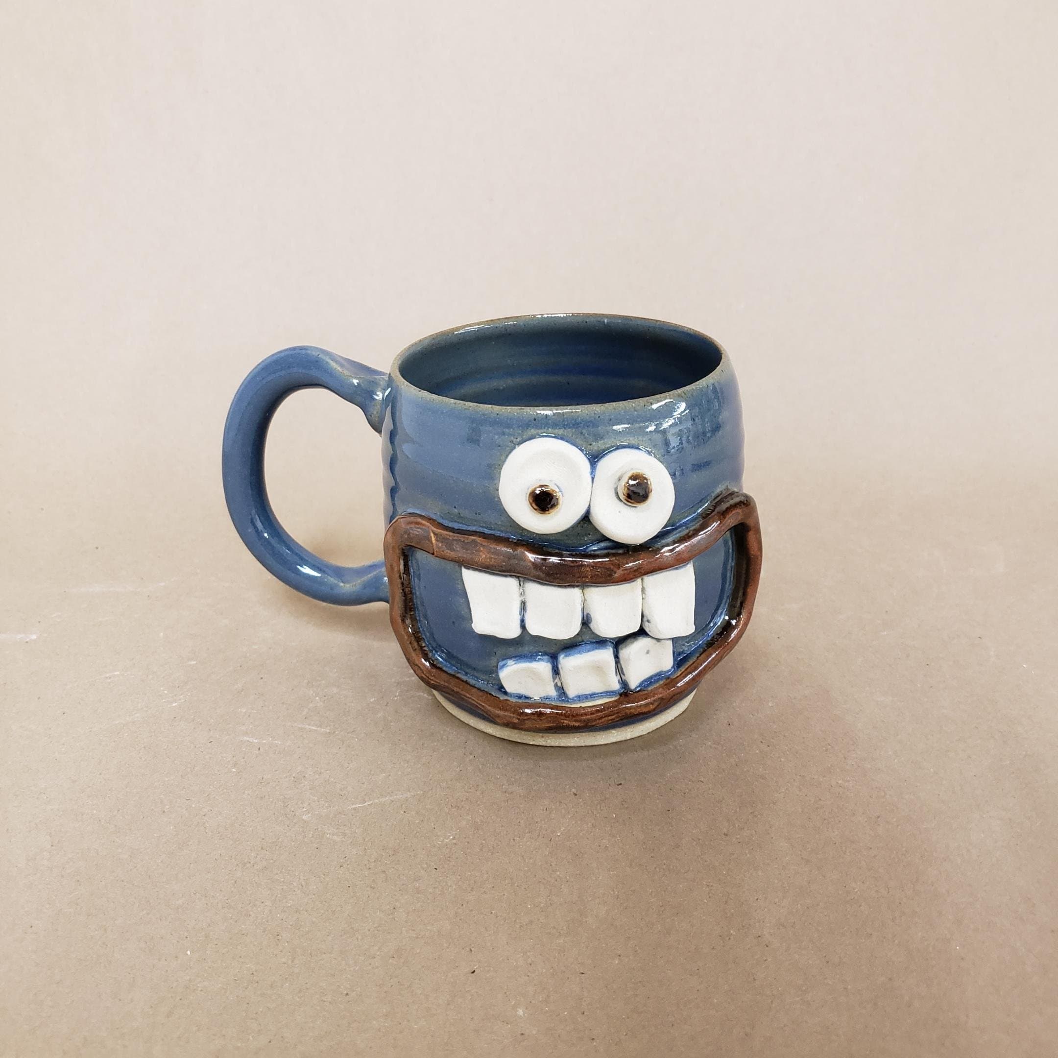 Handmade Pottery Coffee Cup. Smiley Face Ug-Chug Mug. 14-18 Ounces. Blue. Hot Cold Beverage. Microwave and Dishwasher Safe Stoneware Clay.