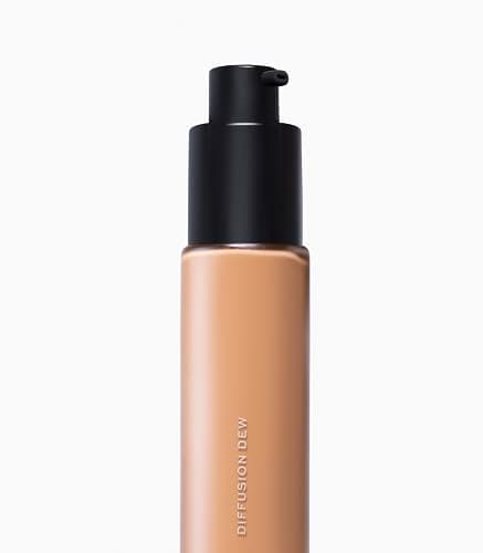 MAKE Beauty Diffusion Dew Skin Tint. Sheer to Medium Coverage Radiant Finish. Blurring, Smoothing, and Brightening for Glowing Complexion. Enhanced with Niacinamide and Adenosine. Caramel 08